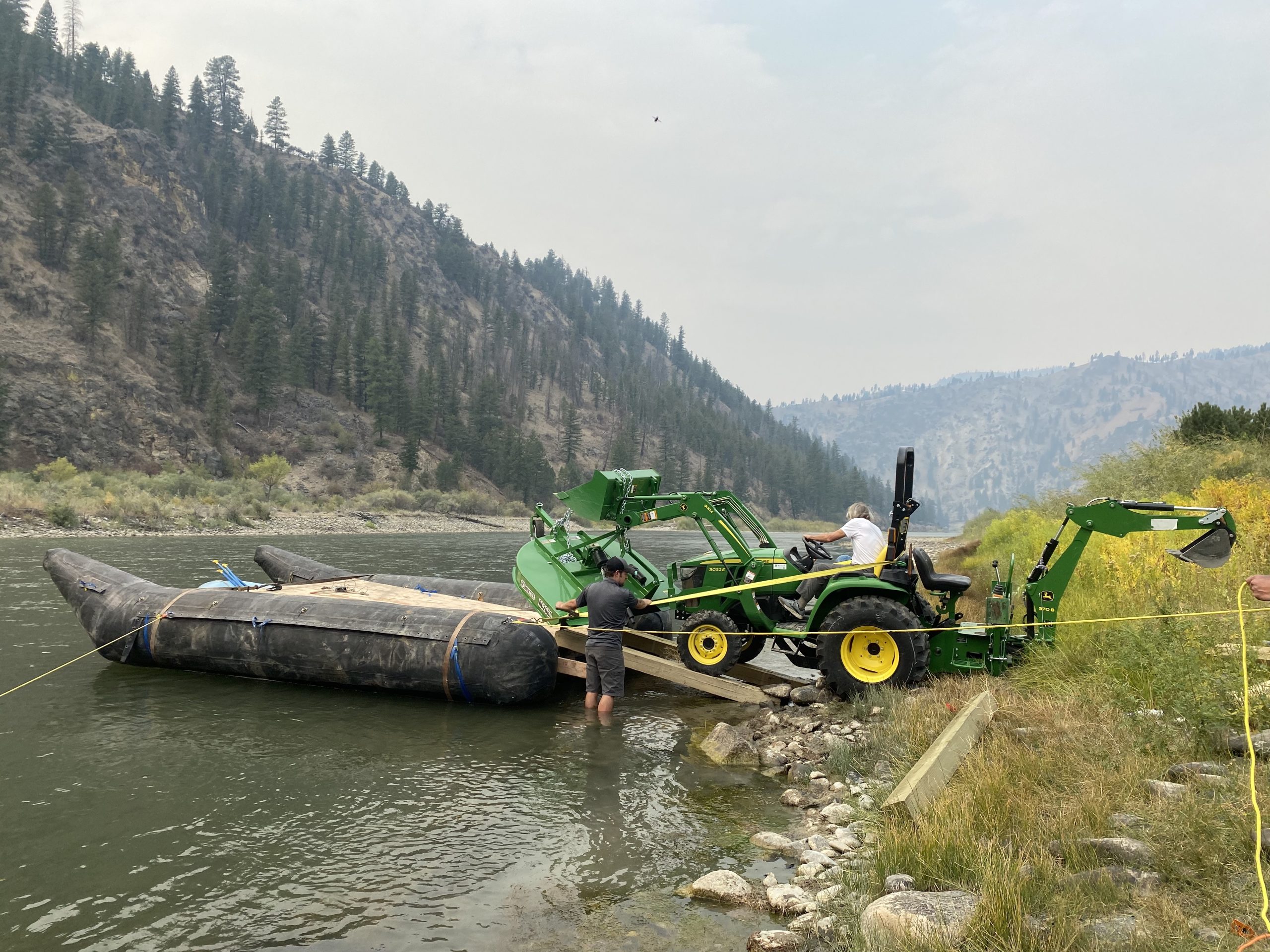 Getting a Tractor Across the River at the Salmon River Adventure Company