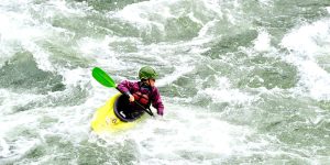Image of a kid kayaking on the Salmon river