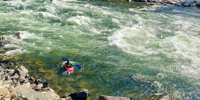 Image of a kayaker in a pink boat