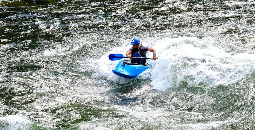 Image of John Snell kayaking