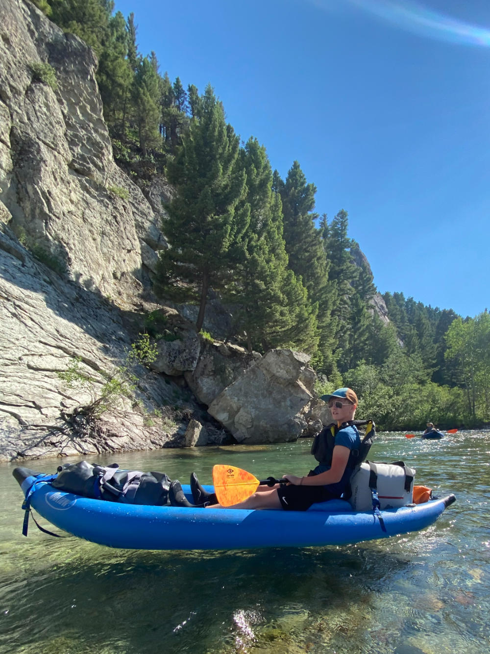 family-camp-boy-kayaking-wild-rivers