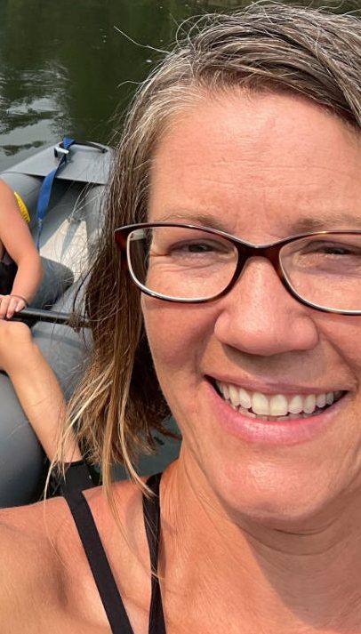 family-camp-mom-and-son-kayaking-wild-river