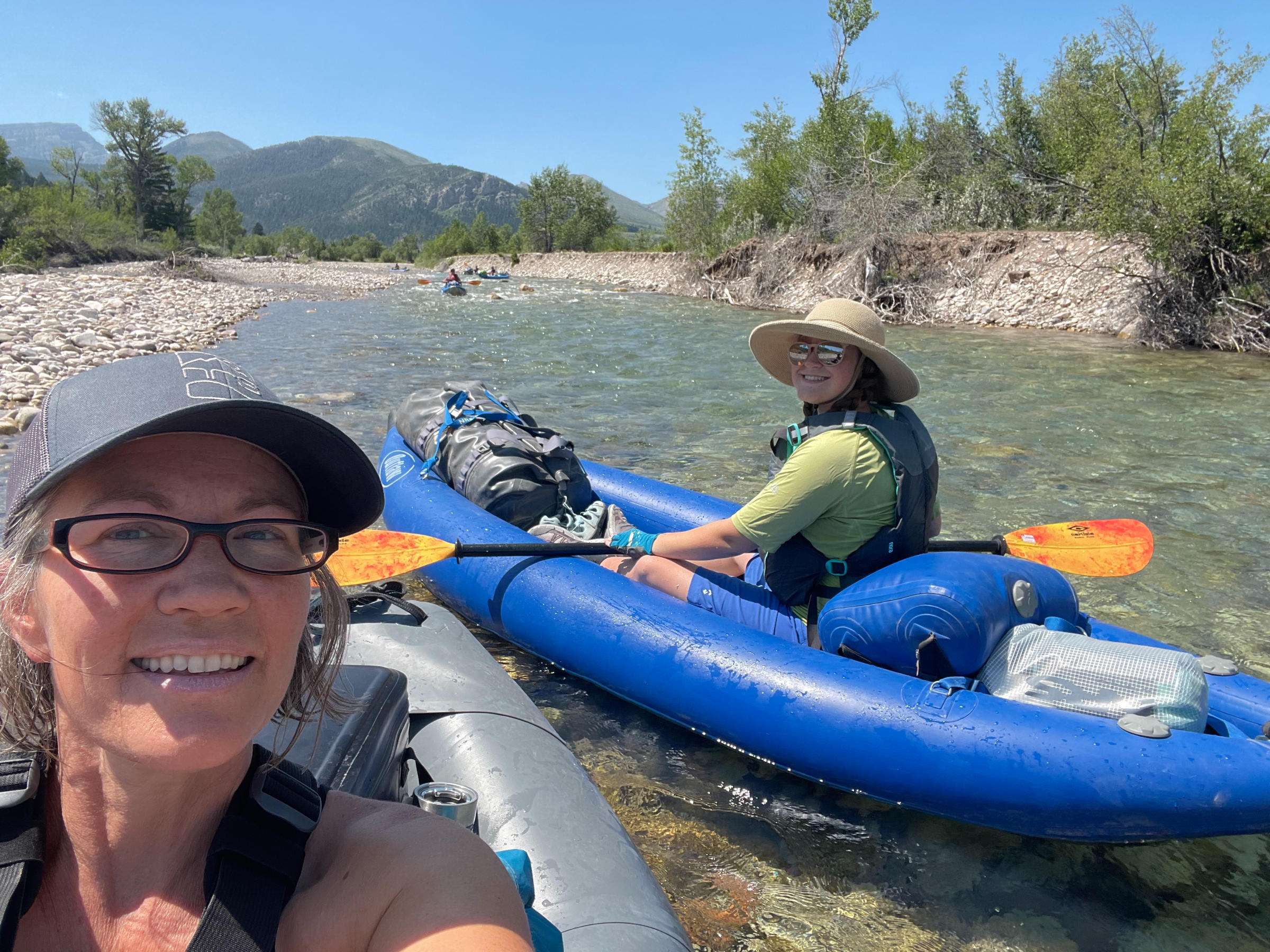 family-camp-mom-and-daughter-kayaking-wild-river