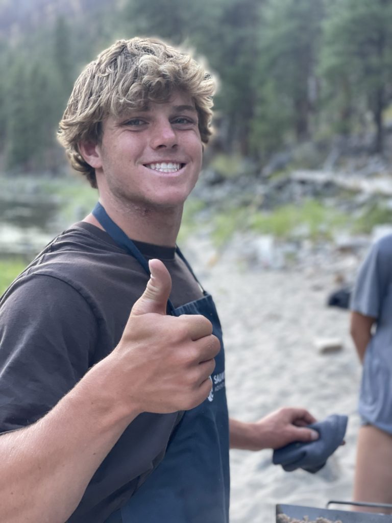 Professional kayaking guide smiling in Idaho wilderness