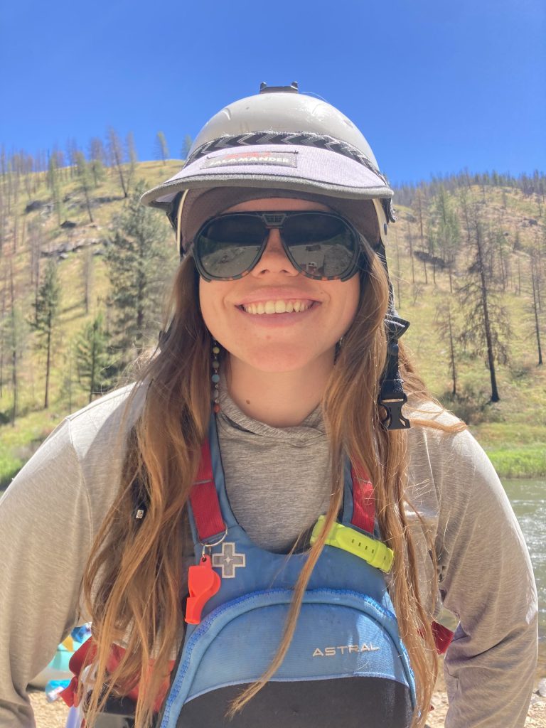 Kayaking instructor smiling in Idaho wilderness.